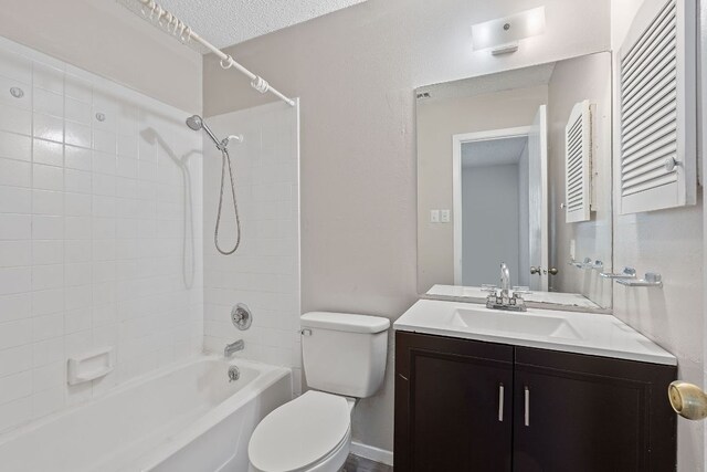 12323 Alderbrook Dr, Austin, TX 78758 - bathroom with vanity, bathing tub / shower combination, and a textured ceiling