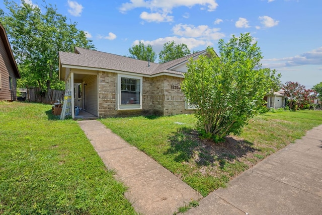 12323 Alderbrook Dr, Austin, TX 78758 - view of front facade with brick siding and a shingled roof
