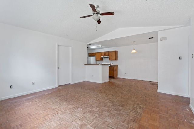 12323 Alderbrook Dr, Austin, TX 78758 - unfurnished living room featuring a ceiling fan, lofted ceiling, and a textured ceiling