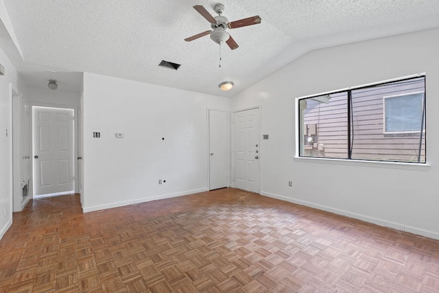 12323 Alderbrook Dr, Austin, TX 78758 - spare room featuring a ceiling fan, a textured ceiling, and lofted ceiling