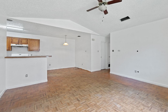 12323 Alderbrook Dr, Austin, TX 78758 - unfurnished living room featuring vaulted ceiling, a ceiling fan, and a textured ceiling