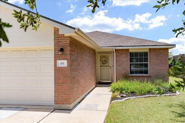 161 Buttercup Way, Kyle, TX 78640 - view of front facade featuring brick siding, an attached garage, and roof with shingles