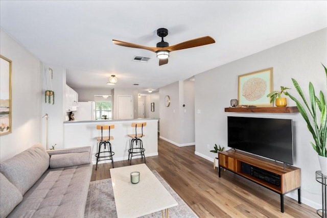161 Buttercup Way, Kyle, TX 78640 - living area with ceiling fan and wood finished floors