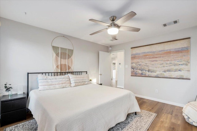 161 Buttercup Way, Kyle, TX 78640 - bedroom with wood finished floors and a ceiling fan