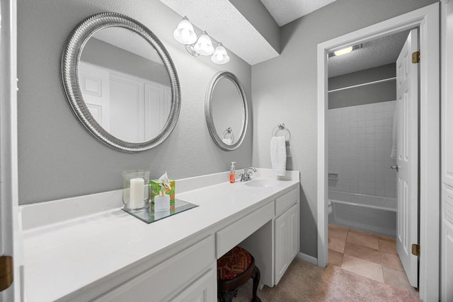 9202 Spring Hollow Dr, Austin, TX 78750 - bathroom with vanity, tub / shower combination, and a textured ceiling