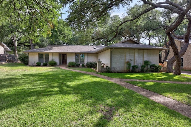 9202 Spring Hollow Dr, Austin, TX 78750 - view of front of property featuring a front lawn and brick siding