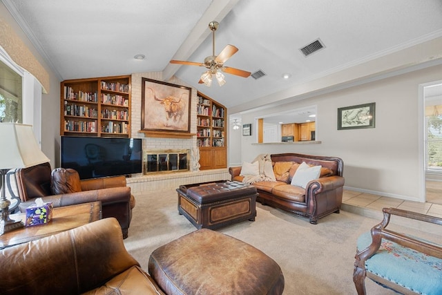 9202 Spring Hollow Dr, Austin, TX 78750 - living room featuring ceiling fan, light carpet, built in shelves, a fireplace, and ornamental molding