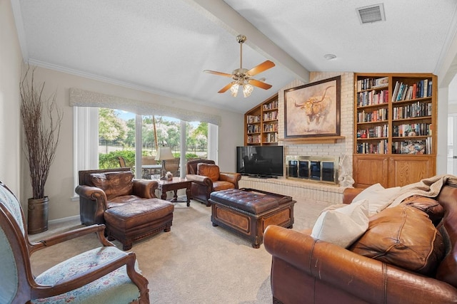 9202 Spring Hollow Dr, Austin, TX 78750 - living area featuring a ceiling fan, light colored carpet, a fireplace, crown molding, and built in features