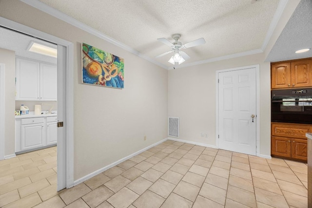 9202 Spring Hollow Dr, Austin, TX 78750 - unfurnished dining area featuring a textured ceiling, ceiling fan, light tile patterned floors, and ornamental molding