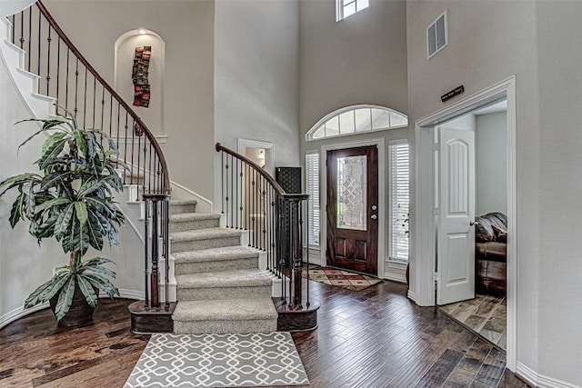 536 Middle Brook Dr, Leander, TX 78641 - entryway with stairs, a high ceiling, and wood finished floors