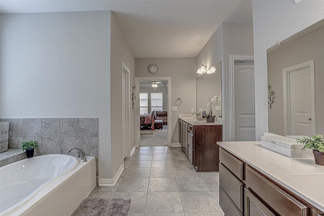 536 Middle Brook Dr, Leander, TX 78641 - full bathroom featuring a garden tub, vanity, connected bathroom, tile patterned floors, and a ceiling fan