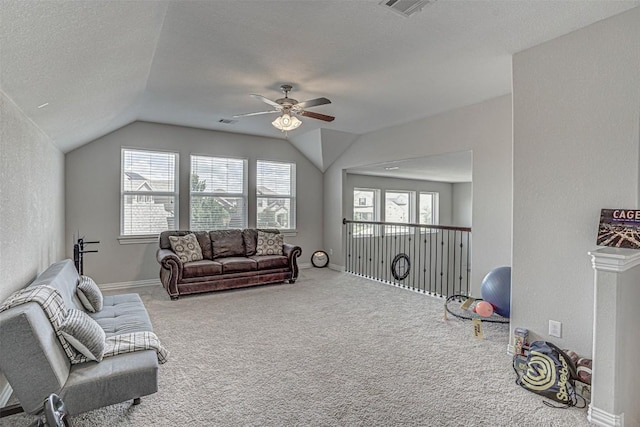 536 Middle Brook Dr, Leander, TX 78641 - living room with ceiling fan, lofted ceiling, carpet floors, healthy amount of natural light, and a textured ceiling