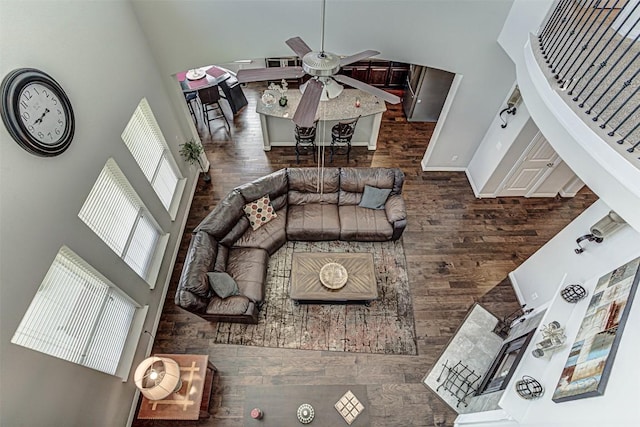 536 Middle Brook Dr, Leander, TX 78641 - living area featuring a towering ceiling, ceiling fan, and wood finished floors