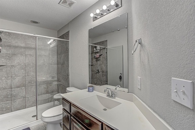 536 Middle Brook Dr, Leander, TX 78641 - full bathroom with a textured wall, a textured ceiling, vanity, and a stall shower