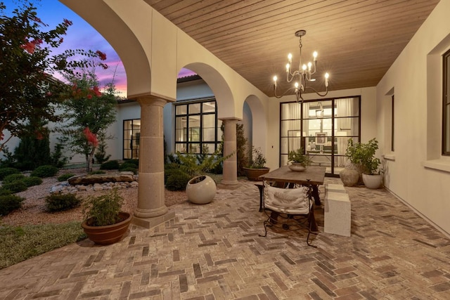 4716 Peralta Ln, Austin, TX 78735 - patio terrace at dusk with a patio and outdoor dining space