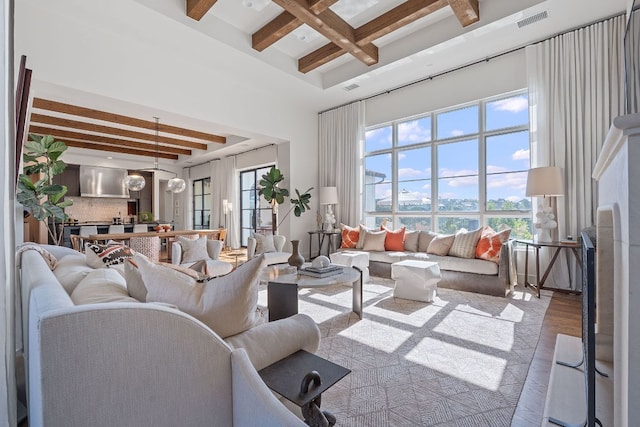 4716 Peralta Ln, Austin, TX 78735 - living area with beamed ceiling, wood finished floors, coffered ceiling, and a high ceiling