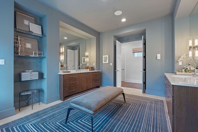 4716 Peralta Ln, Austin, TX 78735 - bathroom featuring two vanities, tile patterned flooring, and a chandelier