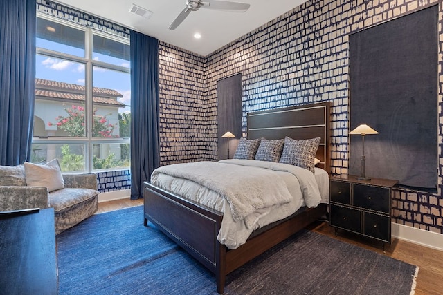 4716 Peralta Ln, Austin, TX 78735 - bedroom featuring wallpapered walls, wood finished floors, and a ceiling fan