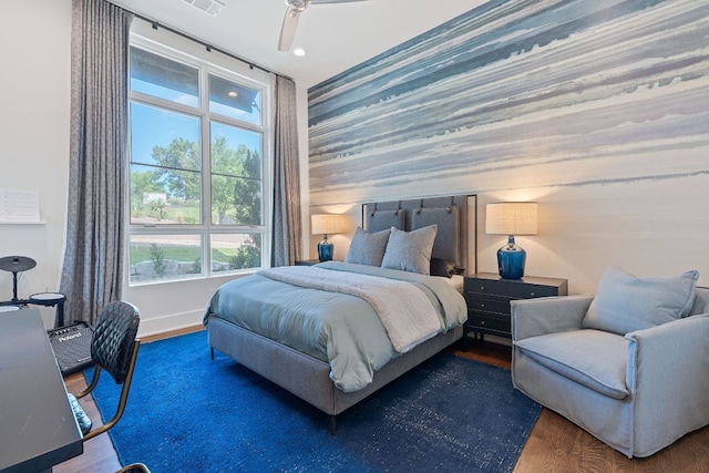 4716 Peralta Ln, Austin, TX 78735 - bedroom with wood finished floors, an accent wall, and recessed lighting