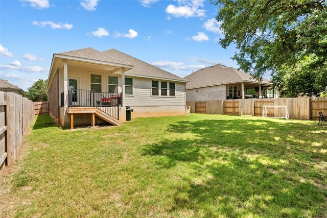 205 Goshen Dr, Dripping Springs, TX 78620 - rear view of property with a fenced backyard and roof with shingles