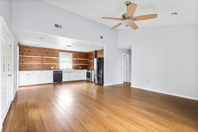 18000 Lafayette Park Rd, Jonestown, TX 78645 - unfurnished living room featuring light wood-style floors, ceiling fan, and high vaulted ceiling
