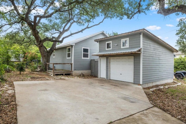 18000 Lafayette Park Rd, Jonestown, TX 78645 - view of front facade featuring a garage and driveway