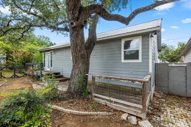 18000 Lafayette Park Rd, Jonestown, TX 78645 - view of property exterior with a metal roof