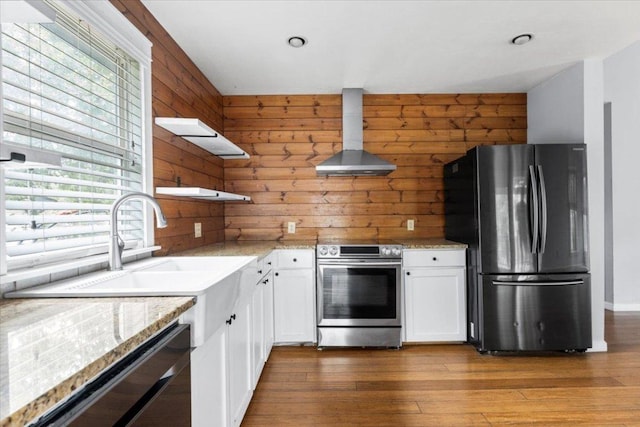 18000 Lafayette Park Rd, Jonestown, TX 78645 - kitchen featuring freestanding refrigerator, wall chimney range hood, stainless steel electric range, open shelves, and white cabinets