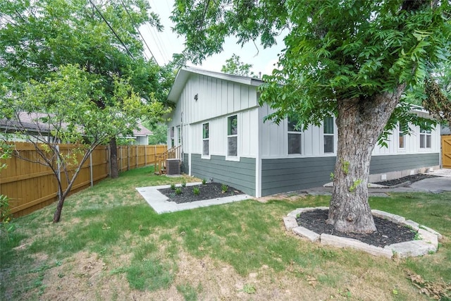 5714 Ave D, Austin, TX 78752 - view of side of property featuring board and batten siding and a central AC unit
