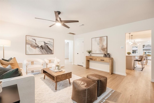 5714 Ave D, Austin, TX 78752 - living room featuring light wood-style flooring and a ceiling fan