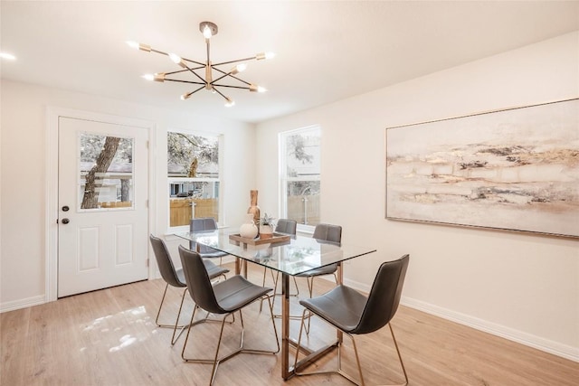 5714 Ave D, Austin, TX 78752 - dining space featuring a chandelier and light wood finished floors