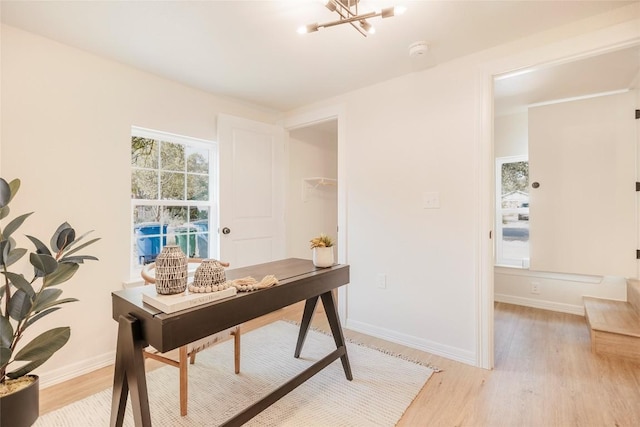 5714 Ave D, Austin, TX 78752 - office featuring light wood finished floors and a chandelier