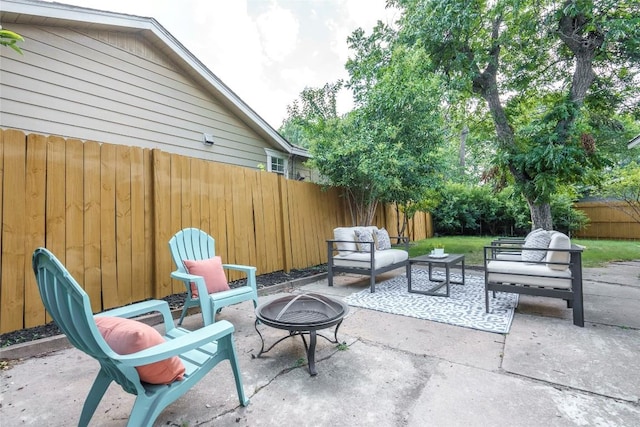 5714 Ave D, Austin, TX 78752 - fenced backyard with a patio area and an outdoor living space with a fire pit