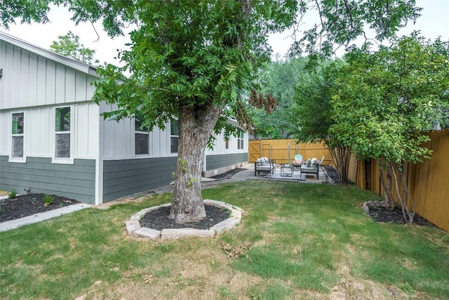 5714 Ave D, Austin, TX 78752 - fenced backyard featuring an outdoor living space and a patio