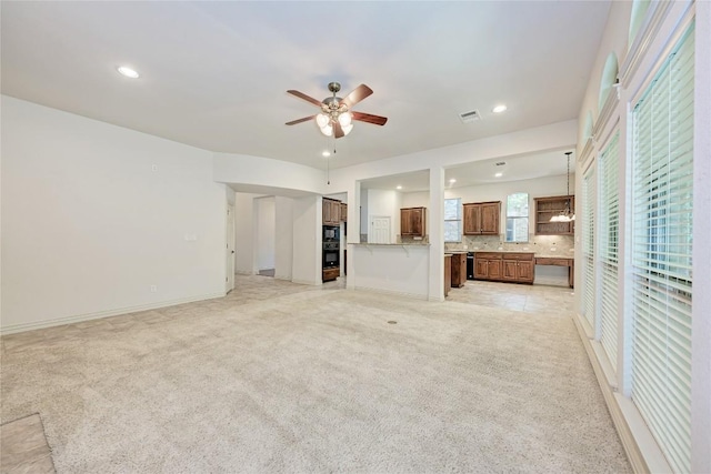 1160 Waimea Bnd, Round Rock, TX 78681 - unfurnished living room with ceiling fan, light colored carpet, and recessed lighting