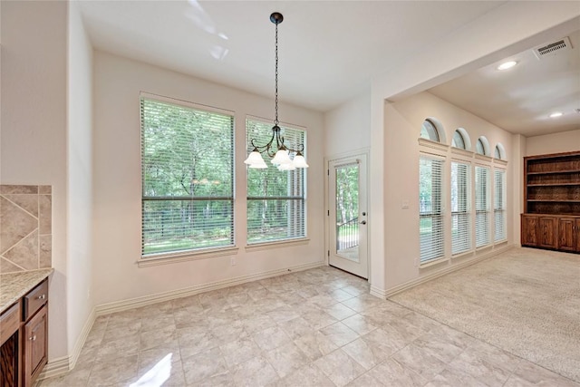 1160 Waimea Bnd, Round Rock, TX 78681 - unfurnished dining area with a chandelier and recessed lighting