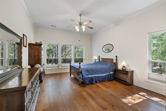 236 Pony Express Dr, Smithville, TX 78957 - bedroom featuring hardwood / wood-style floors, multiple windows, ornamental molding, and a ceiling fan