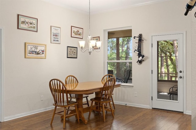 236 Pony Express Dr, Smithville, TX 78957 - dining area with wood-type flooring, a chandelier, and ornamental molding
