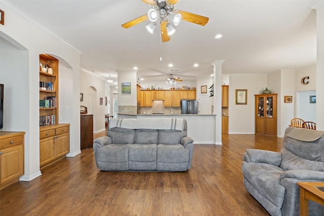 236 Pony Express Dr, Smithville, TX 78957 - living room featuring ceiling fan, dark wood-type flooring, recessed lighting, ornamental molding, and arched walkways