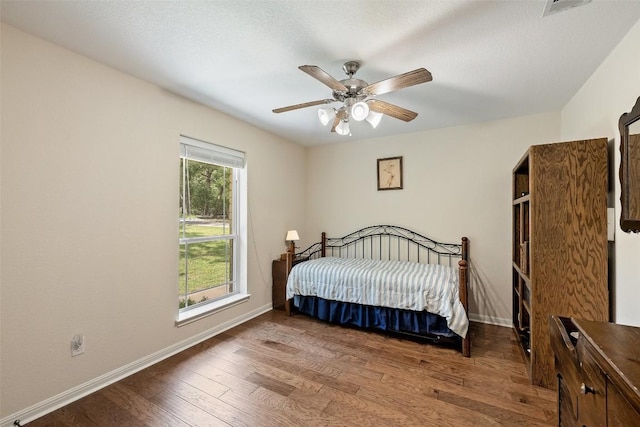 236 Pony Express Dr, Smithville, TX 78957 - bedroom with wood finished floors and a ceiling fan