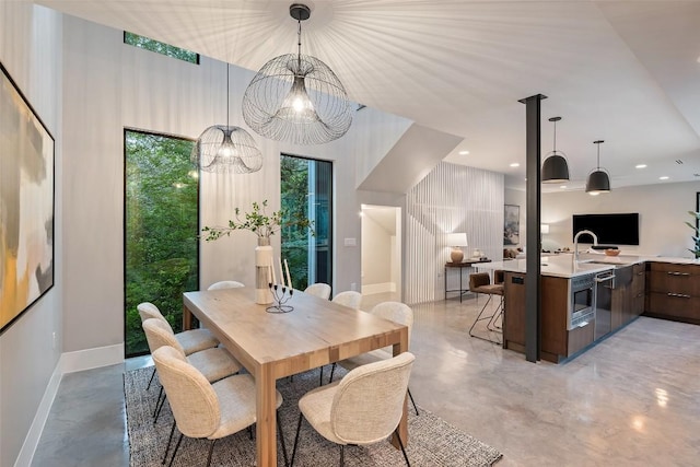 1327 Bonham Ter Unit B, Austin, TX 78704 - dining area with concrete flooring, a chandelier, and recessed lighting