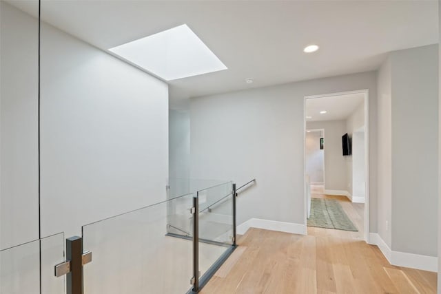 1327 Bonham Ter Unit B, Austin, TX 78704 - hall featuring a skylight, light wood-type flooring, and recessed lighting