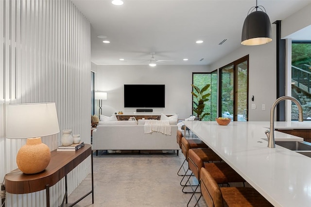 1327 Bonham Ter Unit B, Austin, TX 78704 - living area featuring concrete floors, a ceiling fan, and recessed lighting