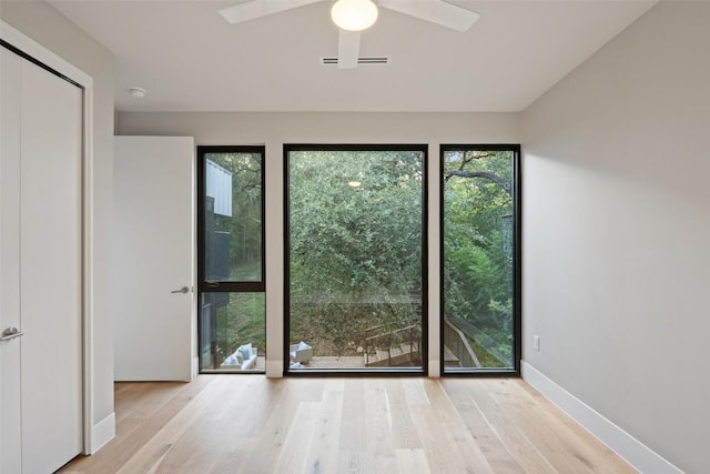 1327 Bonham Ter Unit B, Austin, TX 78704 - doorway with wood finished floors and ceiling fan