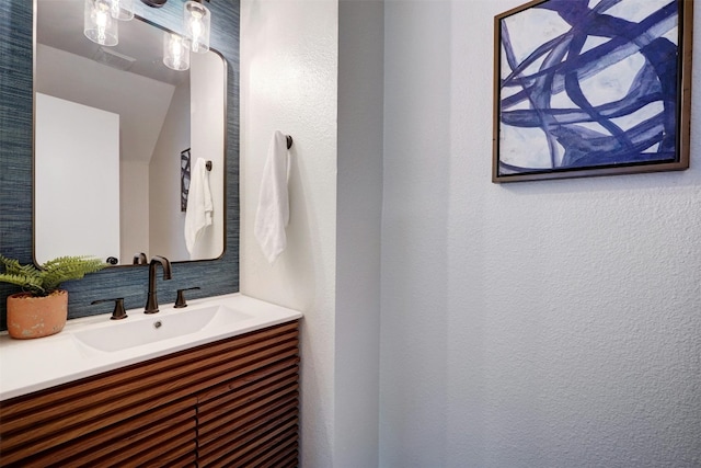 1109 Minerva St, Austin, TX 78753 - bathroom featuring vanity and a textured wall