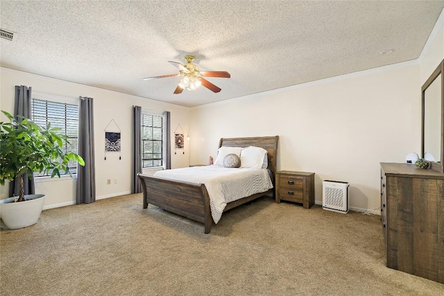 5910 Abilene Trl, Austin, TX 78749 - bedroom with carpet flooring, crown molding, a textured ceiling, and a ceiling fan