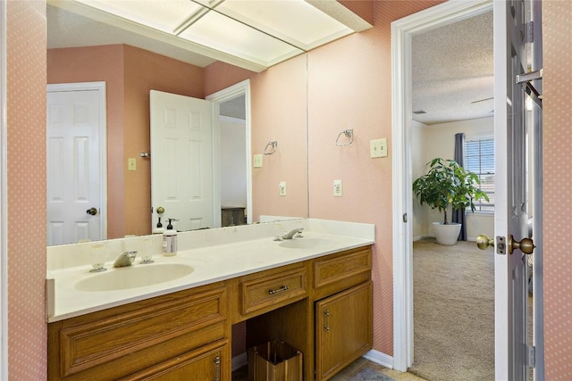 5910 Abilene Trl, Austin, TX 78749 - full bath featuring double vanity and a textured ceiling