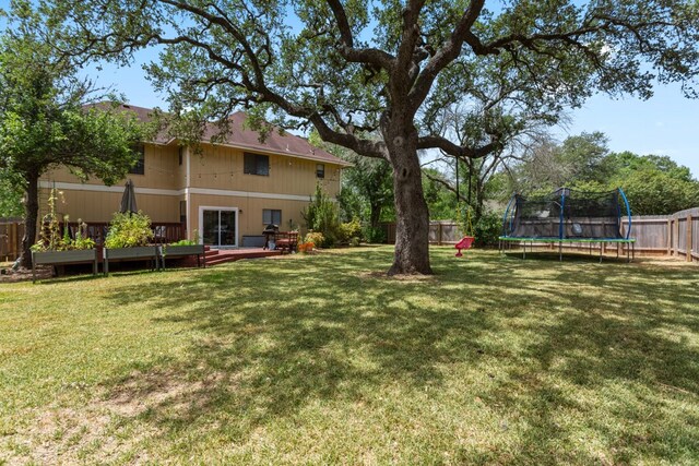 5910 Abilene Trl, Austin, TX 78749 - fenced backyard with a trampoline and a deck
