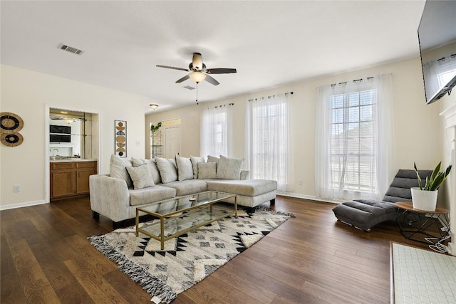 5910 Abilene Trl, Austin, TX 78749 - living area with a ceiling fan and dark wood-type flooring