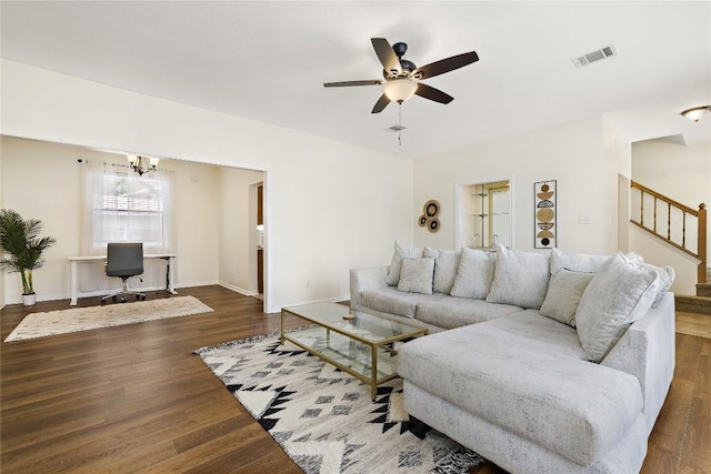 5910 Abilene Trl, Austin, TX 78749 - living area featuring a desk, stairway, a ceiling fan, wood finished floors, and a chandelier